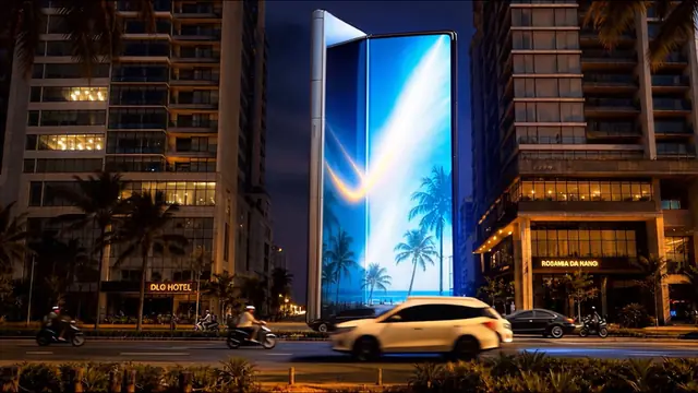 Partially open Galaxy Z Fold from the front with a luminous coastal scene blooming across the folding display.