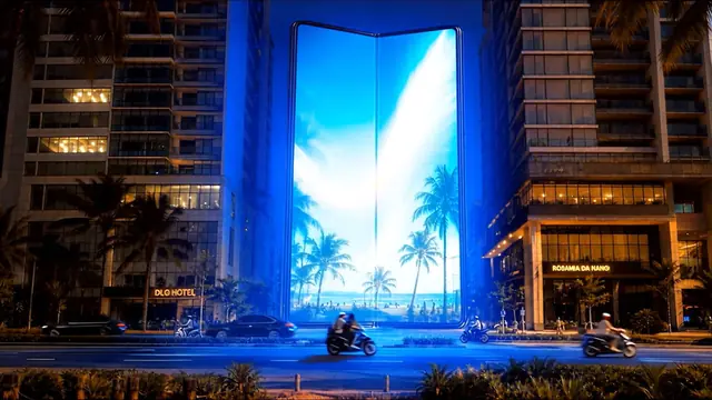 Fully open Galaxy Z Fold hero view with the beach and palm world glowing across the unfolded screen above the street.